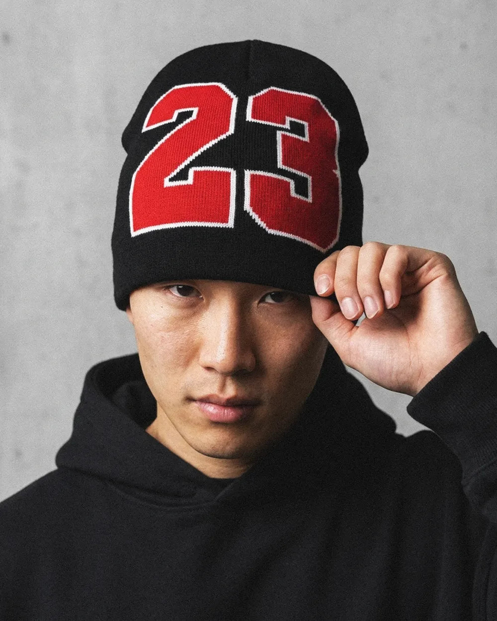 asian man with a "23" Beanie