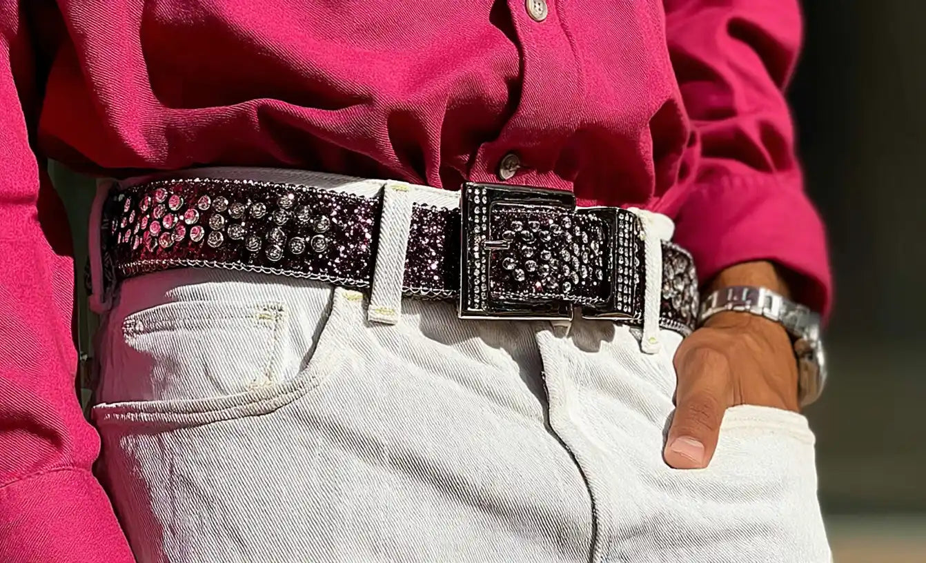 Sparkly crystal y2k belt with wide buckle, styled with white jeans and pink shirt.
