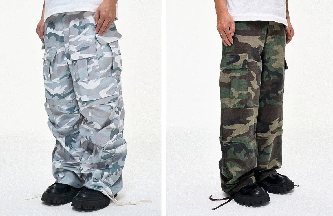 White and gray camouflage cargo pants with side pockets for a clean urban look paired with khaki green camo cargo pants with a baggy cut and adjustable drawstring cuffs.